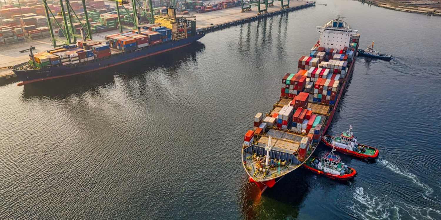 Modern container ship being loaded at a shipping terminal
